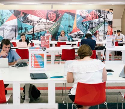 people sitting at desks using computers