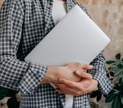 man holding laptop